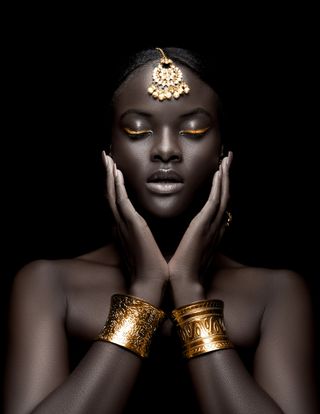 Portrait of an Afro-American woman wearing gold bangles