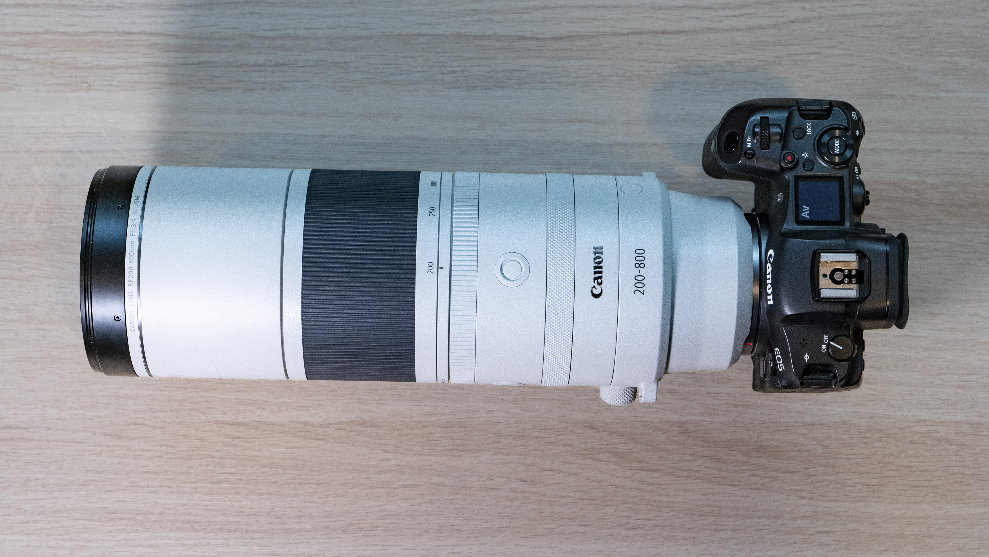 Canon RF 200-800mm F6.3-9 lens on a table from above, mounted to a Canon EOS R5