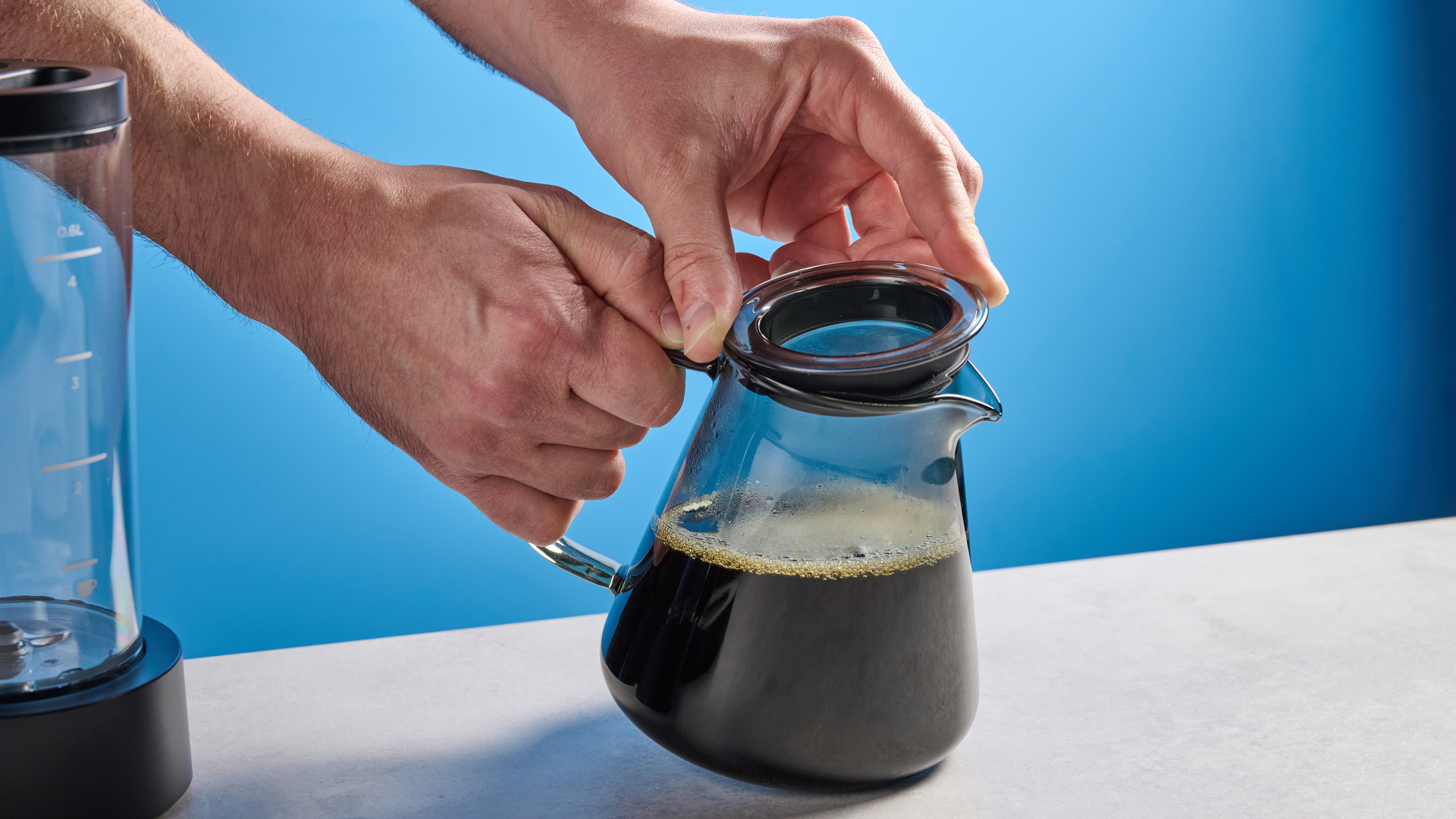 the ratio four coffee maker photographed against a blue tom's guide background