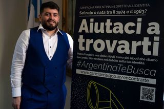 The Italian son of the late football idol Diego Maradona, Diego Armando Maradona Sinagra, known as Diego Junior, poses by a poster of an International Campaign for the Right to Identity, after he was granted the Argentine nationality on March 25, 2021 during a ceremony at the Argentine consulate in Rome. - Diego Junior is joining the International Campaign for the Right to Identity which helps search for the children stolen by the Argentinian dictatorship from their missing parents, and helps Italians who have had links with Argentina between 1974 and 1983 and who have doubts about their identity. The poster reads : "Argentina's Campaign for the Right to Identity : Help us find you. You may be one of the grandsons and granddaughters we are looking for. Don't remain in any doubt about your identity." (Photo by Tiziana FABI / AFP) (Photo by TIZIANA FABI/AFP via Getty Images)