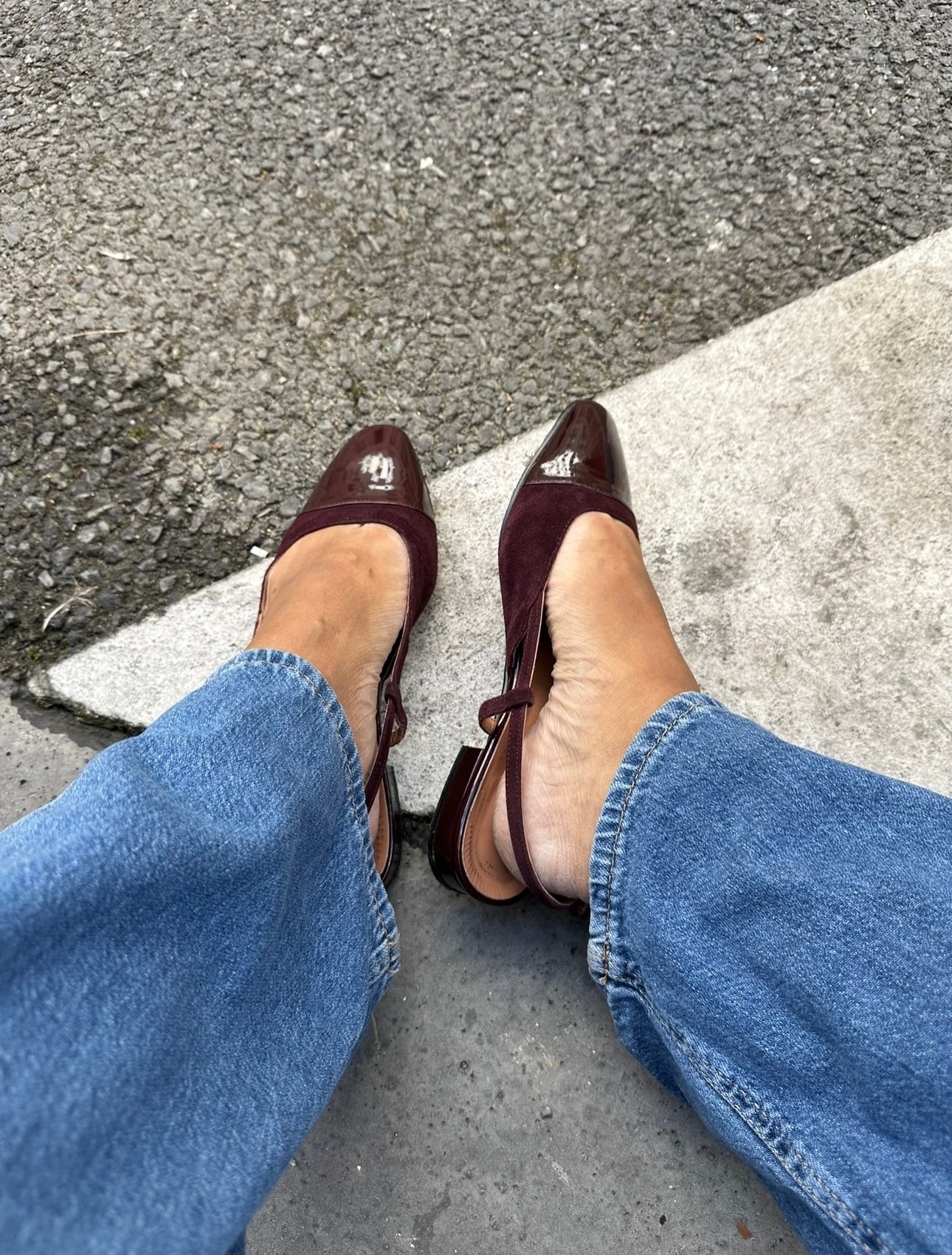 Woman in jeans and cap-toe shoes