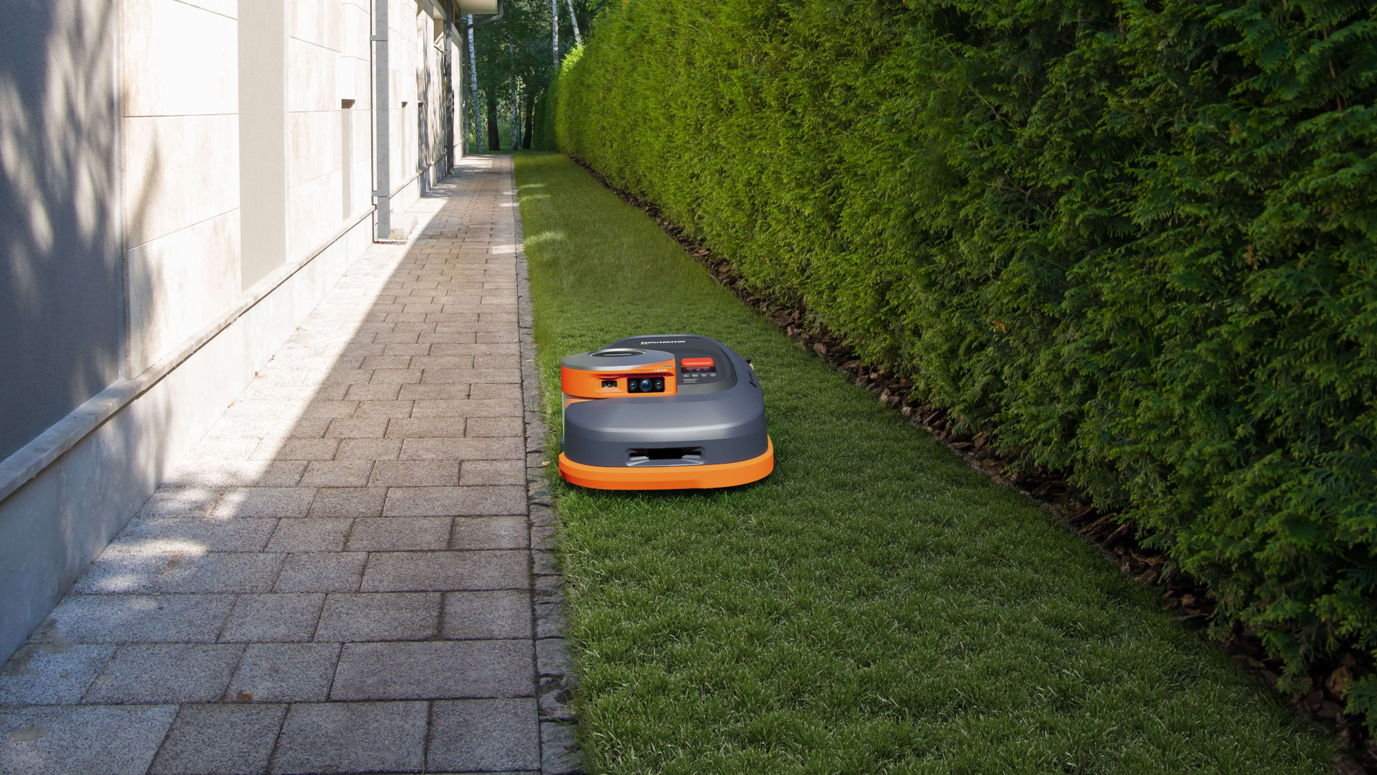 Segway Navimow H2 Series cutting grass in a tight space.