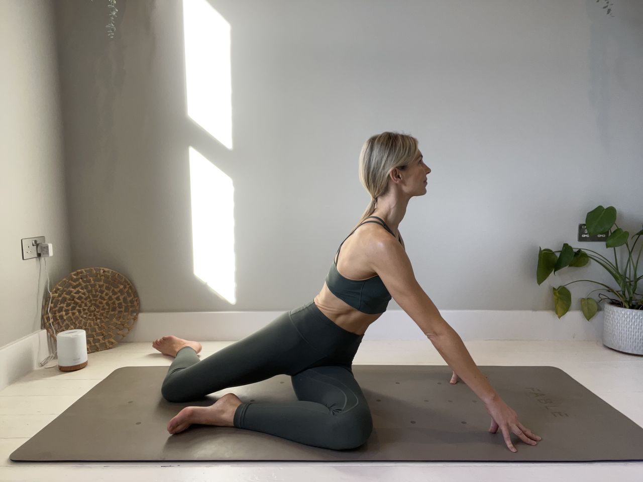 Pilates instructor Gemma Folkard demonstrating the mermaid stretch