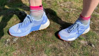 Woman wearing Adidas Terrex Agravic Ultra trail running shoes