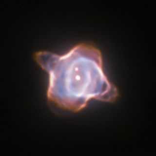 The Stingray nebula, imaged by the Wide Field and Planetary Camera 2 in 1998. The nebula is 2,700 miles away and hosts a fast-evolving star at its core, increasing drastically in heat and now cooling again.