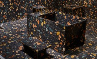 The black marmoreal material was applied to the entire bathroom project, from bathtub to toilet