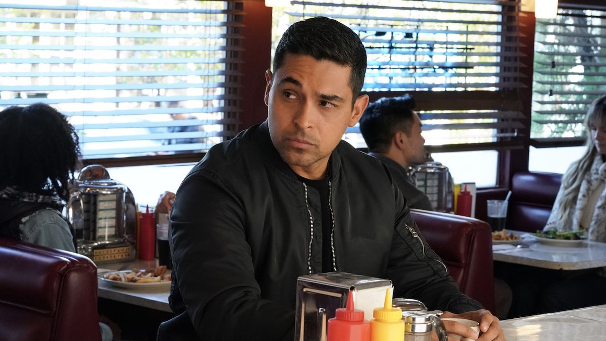 Wilmer Valderrama&#039;s Nick Torres seated at diner counter in NCIS