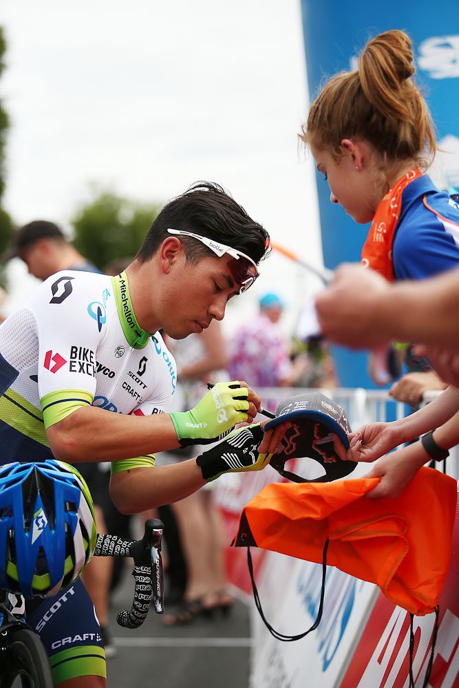 Caleb Ewan of Orica-GreenEdge signs an autograph before competing during stage 1 of the 2016 Tour Down Under