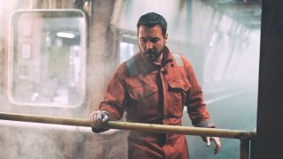 Martin Compston in a boiler suit in The Rig