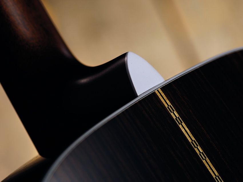 The Style XIII's back and sides are solid East Indian rosewood.
