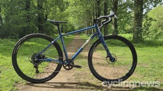 A blue Sonder Camino gravel bike on some single track