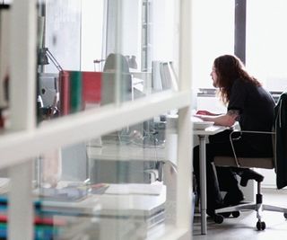 Natural light streams through full-width windows and reflects off all the glass and laminate surfaces inside the studio – creating a bright and airy atmosphere