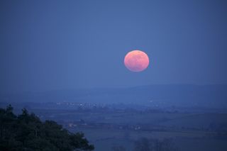 The full moon of March 19, 2011 - a so-called supermoon - rises over the villiage of Brill in the U.K. as seen by skywatcher Ian Griffin. 
