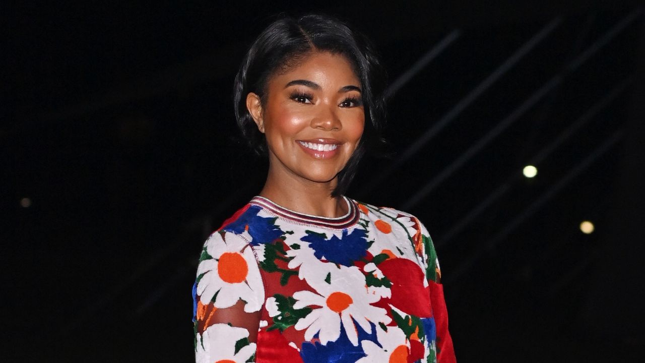 Gabrielle Union Burberry show Daniel Lee floral dress thong sandals heels yellow saddle bag London Fashion Week