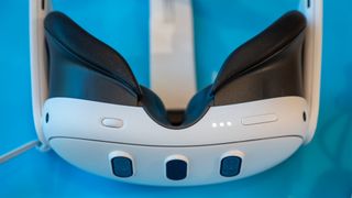 Meta Quest 3 white VR headset close up showing cameras and head straps