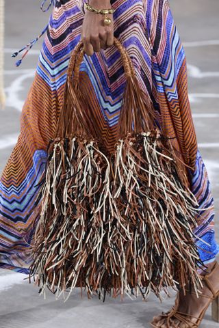 close up shot of multicolor Ulla Johnson fringe bag on runway