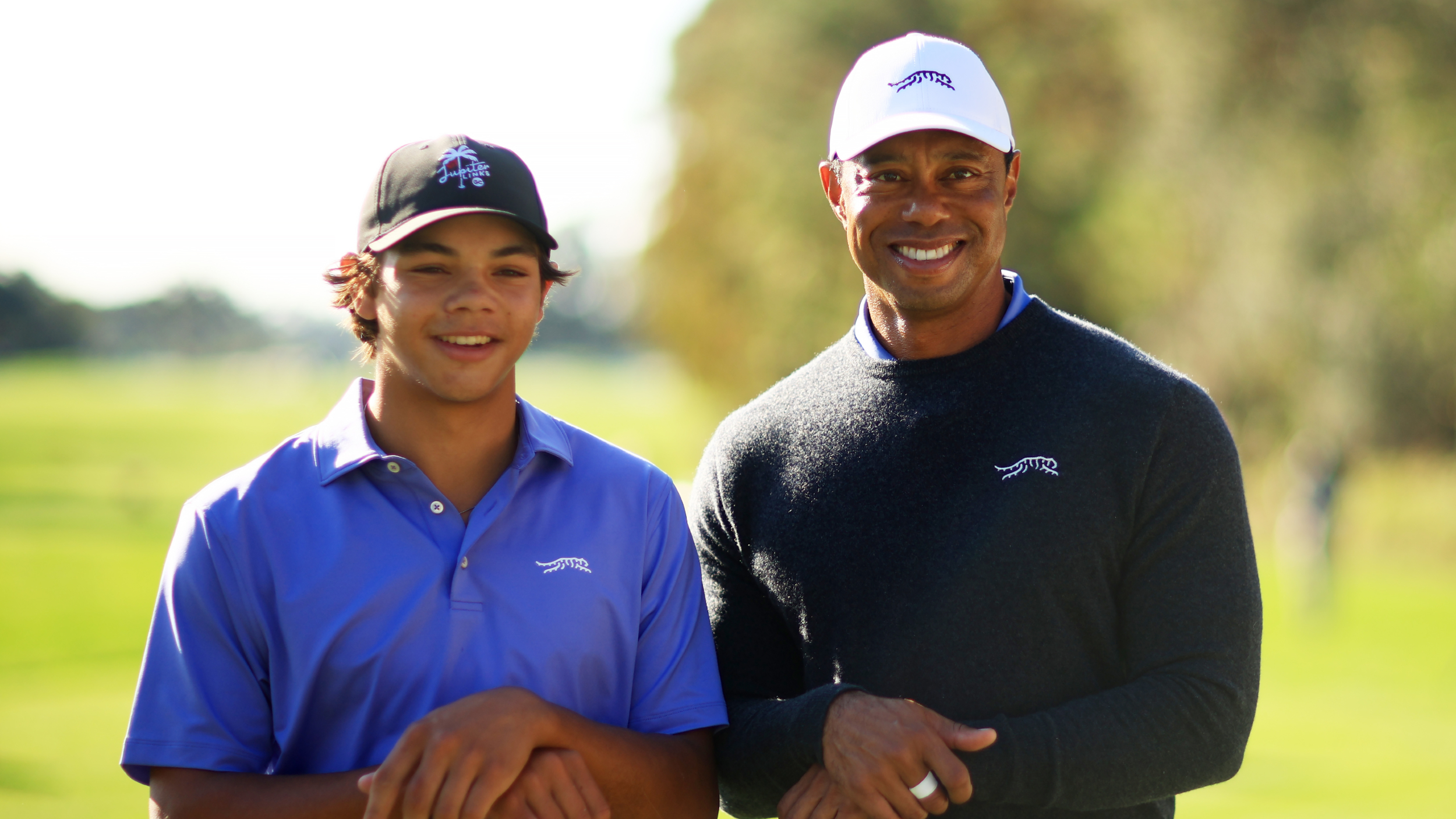 Tiger and Charlie Woods pose for a photo before the PNC Championship 