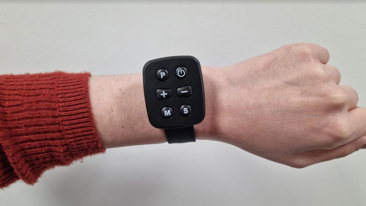 A wrist-worn remote control for the Bluefin Fitness Task 2.0 Treadmill