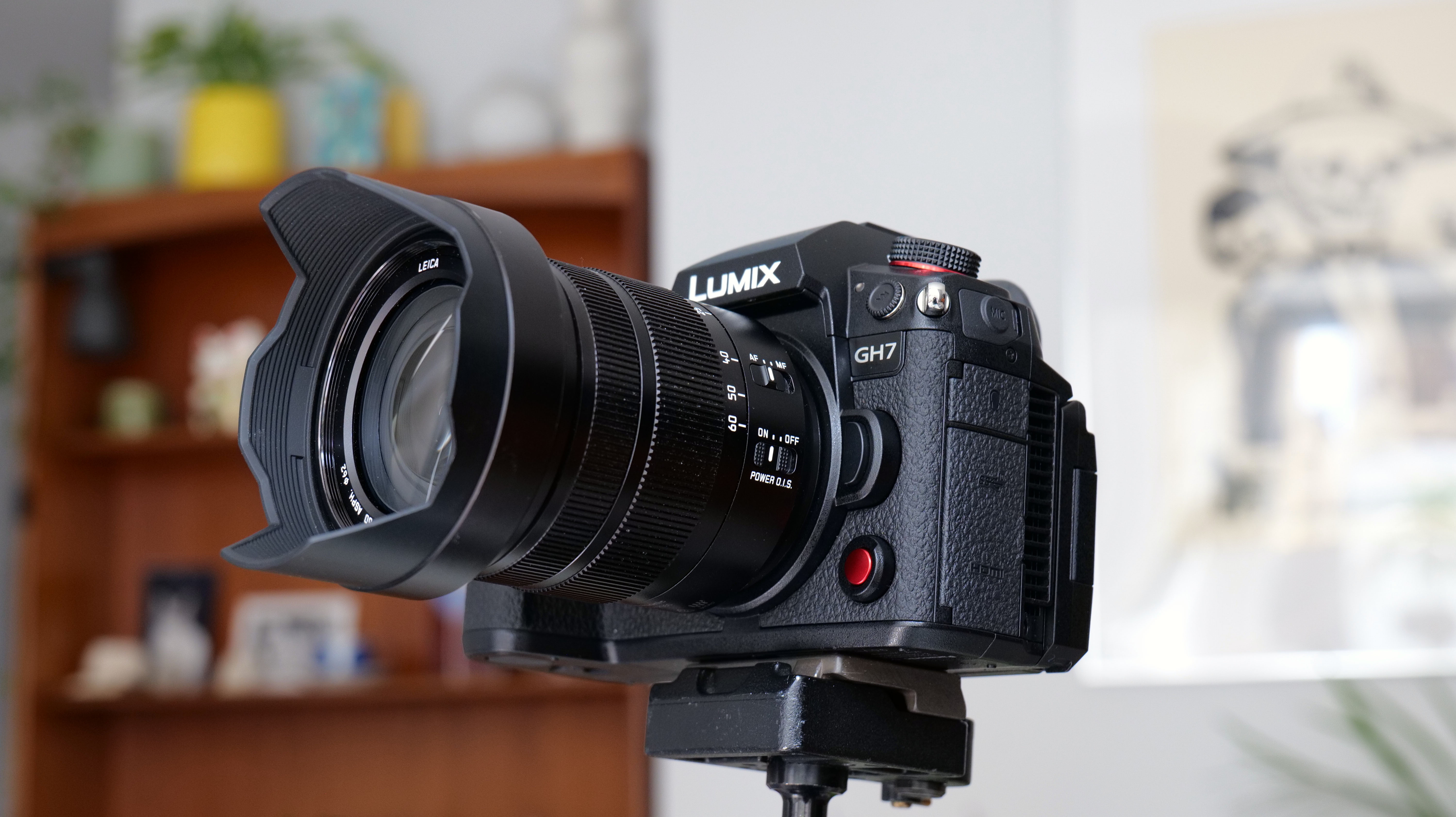 Panasonic Lumix GH7 camera and lens being adjusted
