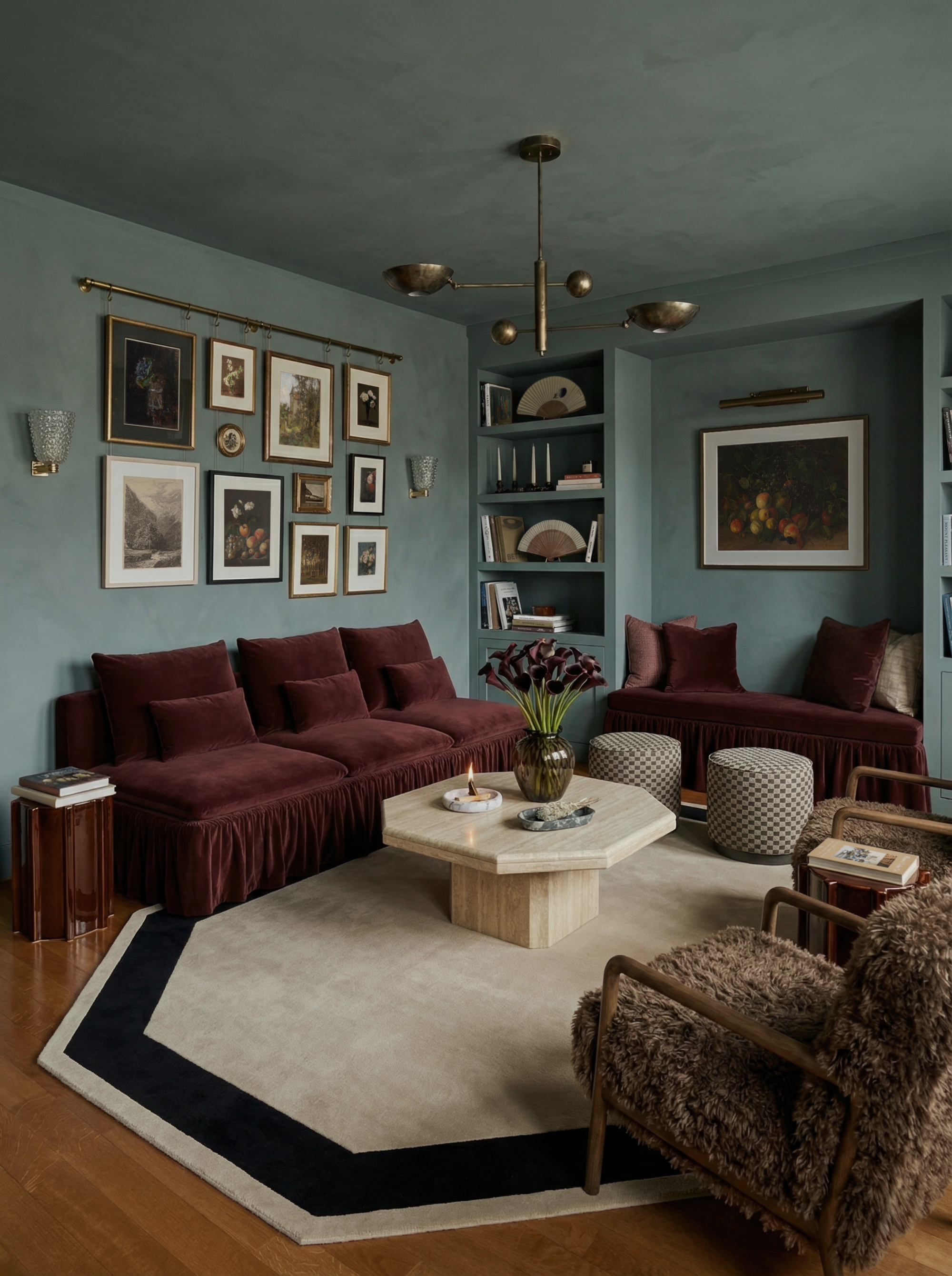 Image of a limewash light blue living room with burgundy velvet seating, a gallery rail of pictures on the wall, a white marble coffee table, and a white rug with a black boarder.