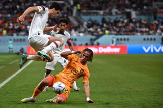 USA's forward #07 Giovanni Reyna (L) fights for the ball with Netherlands' midfielder #25 Xavi Simons during the Qatar 2022 World Cup round of 16 football match between the Netherlands and USA at Khalifa International Stadium in Doha on December 3, 2022.