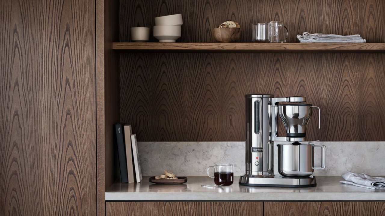 The Aarke coffee maker in a modern, wood kitchen 