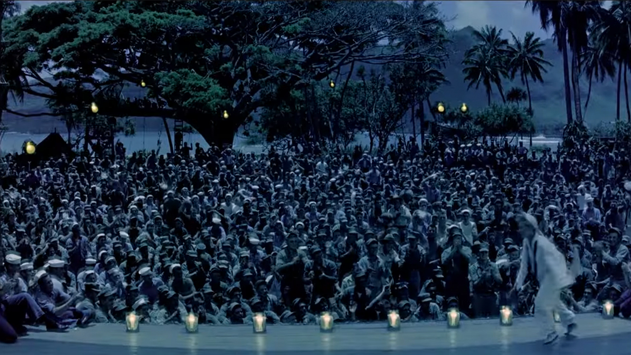 A crowd watching a stage show in South Pacific