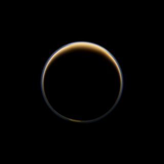 NASA's Cassini spacecraft looks toward the night side of Saturn's moon Titan and sees sunlight scattering its atmosphere, forming a colorful ring. The images were acquired on June 6, 2012, when Cassini was about 134,000 miles from Titan. Image scale is 8 miles per pixel.