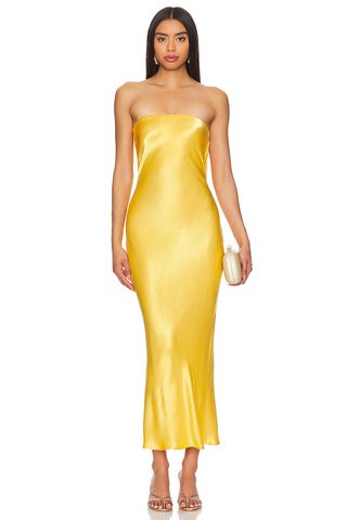 revolve model in bec & bridge yellow satin dress