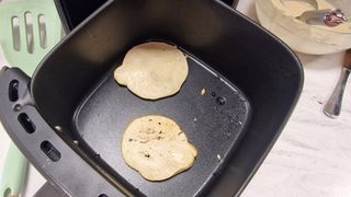 Pancakes cooking in an air fryer