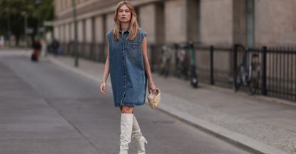 Woman in a denim midi dress GettyImages-2011584064