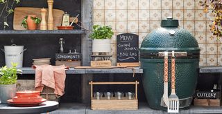 outdoor kitchen area with Big green egg BBQ to show how to cool down a room by cooking outside