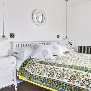 white bedroom with floral bedlinen