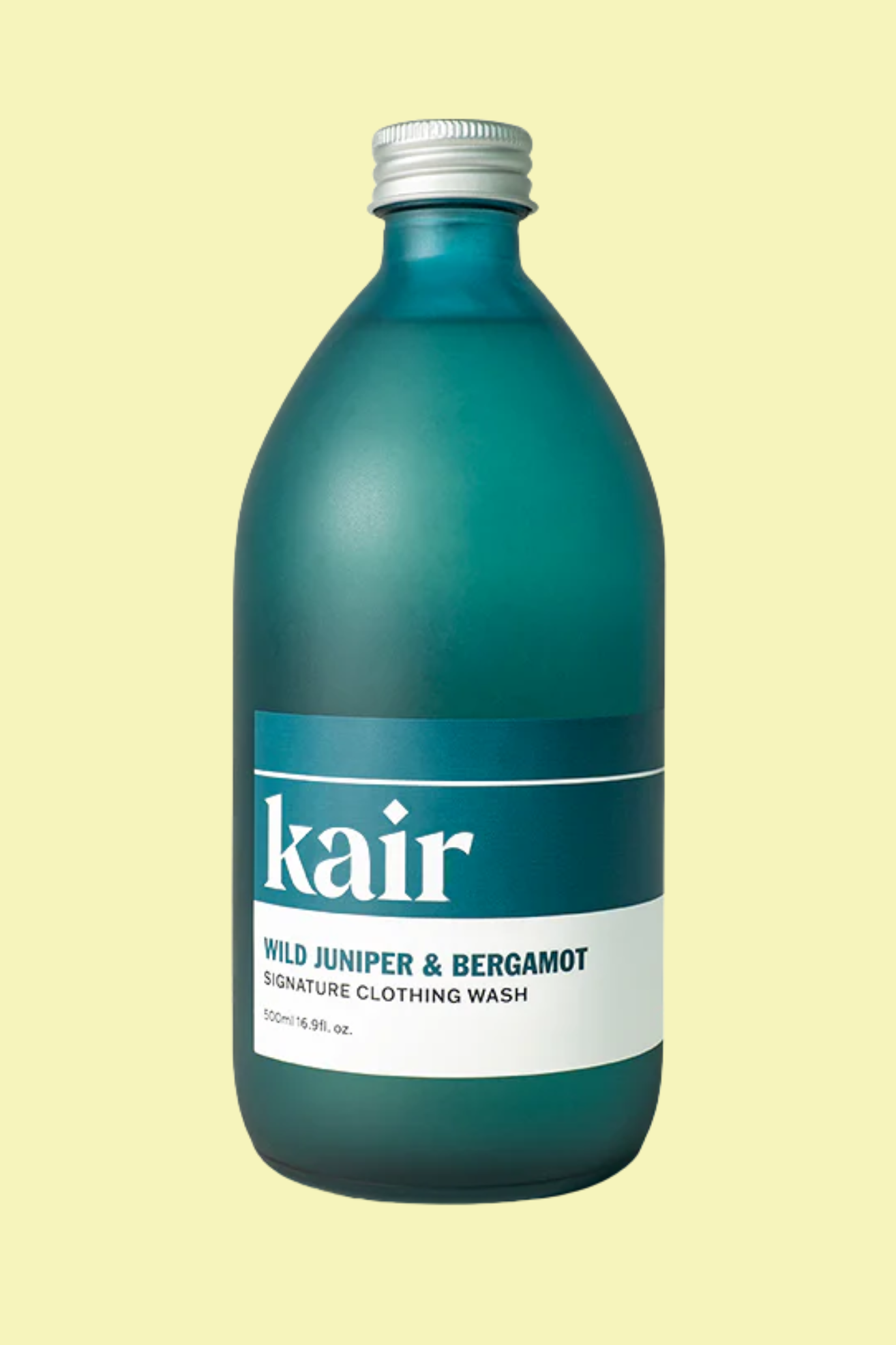 A teal bottle of laundry detergent against a light yellow background