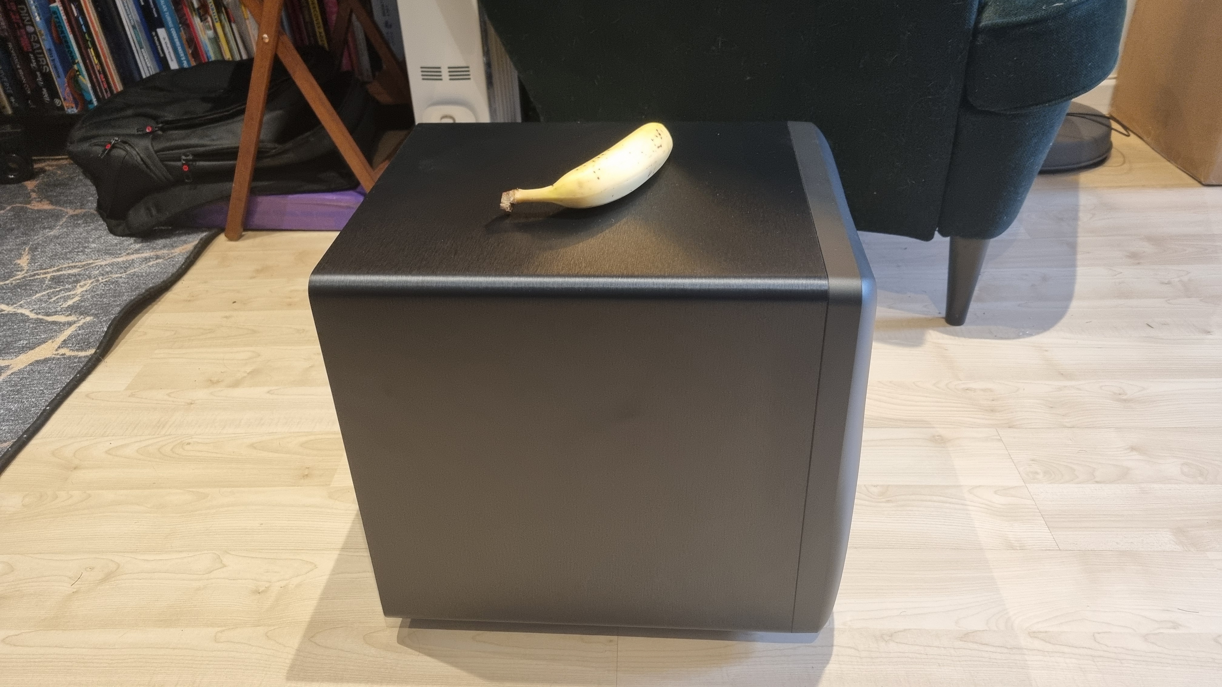 A profile shot of the Mackie CR8SBT subwoofer with a banana for scale