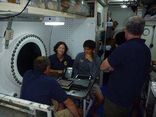 NEEMO 15 Crew Gathers at the Galley Table
