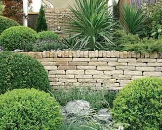 traditional Cotswold stone garden wall