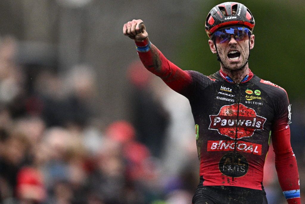 Belgian Eli Iserbyt celebrates as he wins the GP Sven Nys race