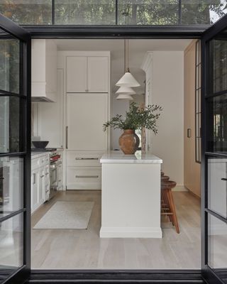 White kitchen with hardwood floor
