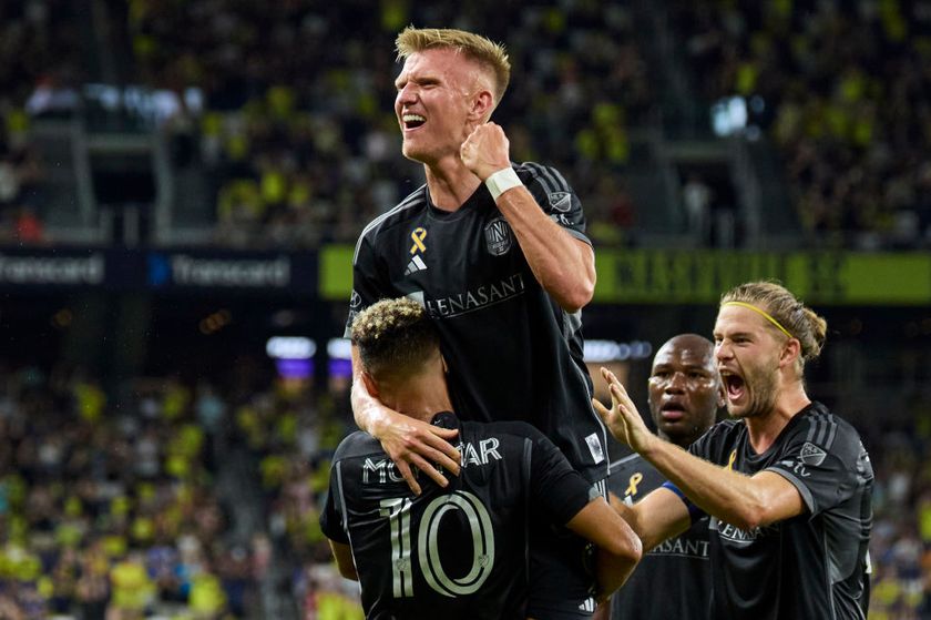 Sam Surridge #9, Walker Zimmerman #25 and Hany Mukhtar #10 of Nashville SC celebrate after a goal against the FC Cincinnati during the first half at GEODIS Park on September 21, 2024 in Nashville, Tennessee. 