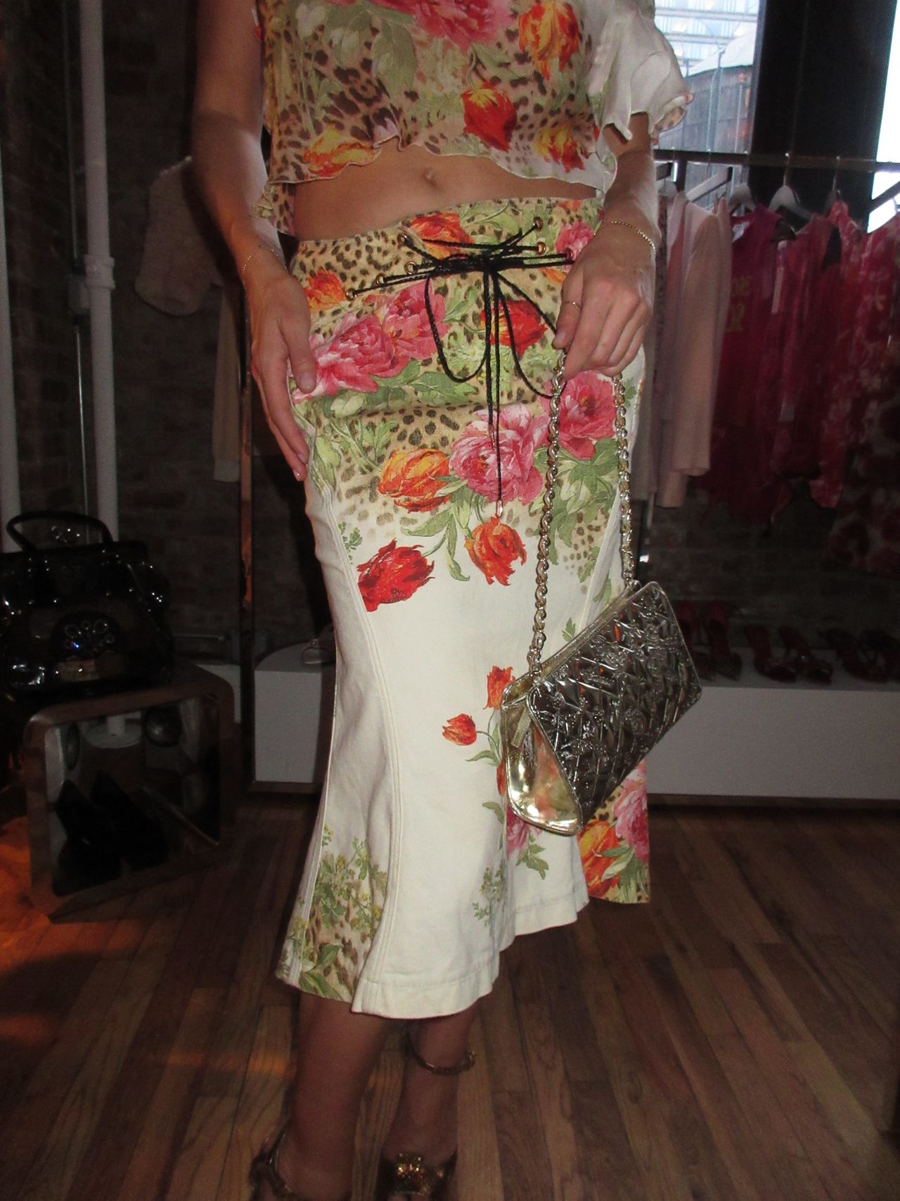Kathryn zahorak wearing floral leopard print top and skirt with silver bag