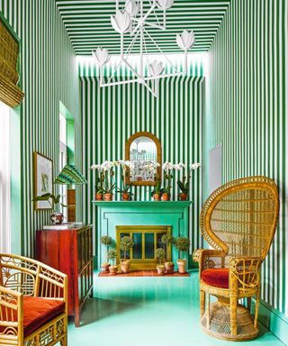Green living room with striped wallpaper