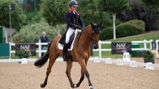Tom McEwan and Toledo De Kerser compete in the dressage phase at Hartpury horse trials