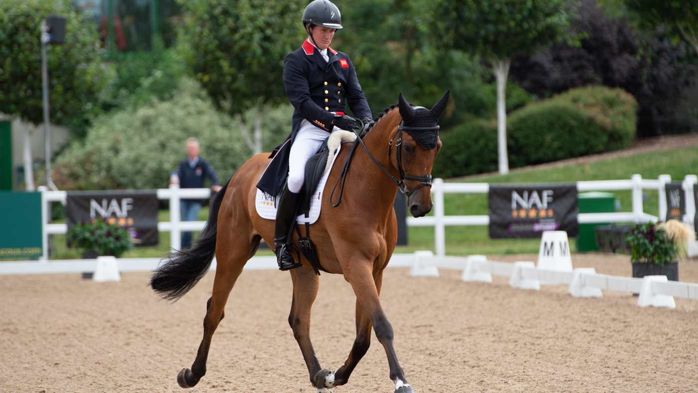 Tom McEwan and Toledo De Kerser compete in the dressage phase at Hartpury horse trials