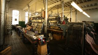 The industrial machines in action at the Cluny Lace factory