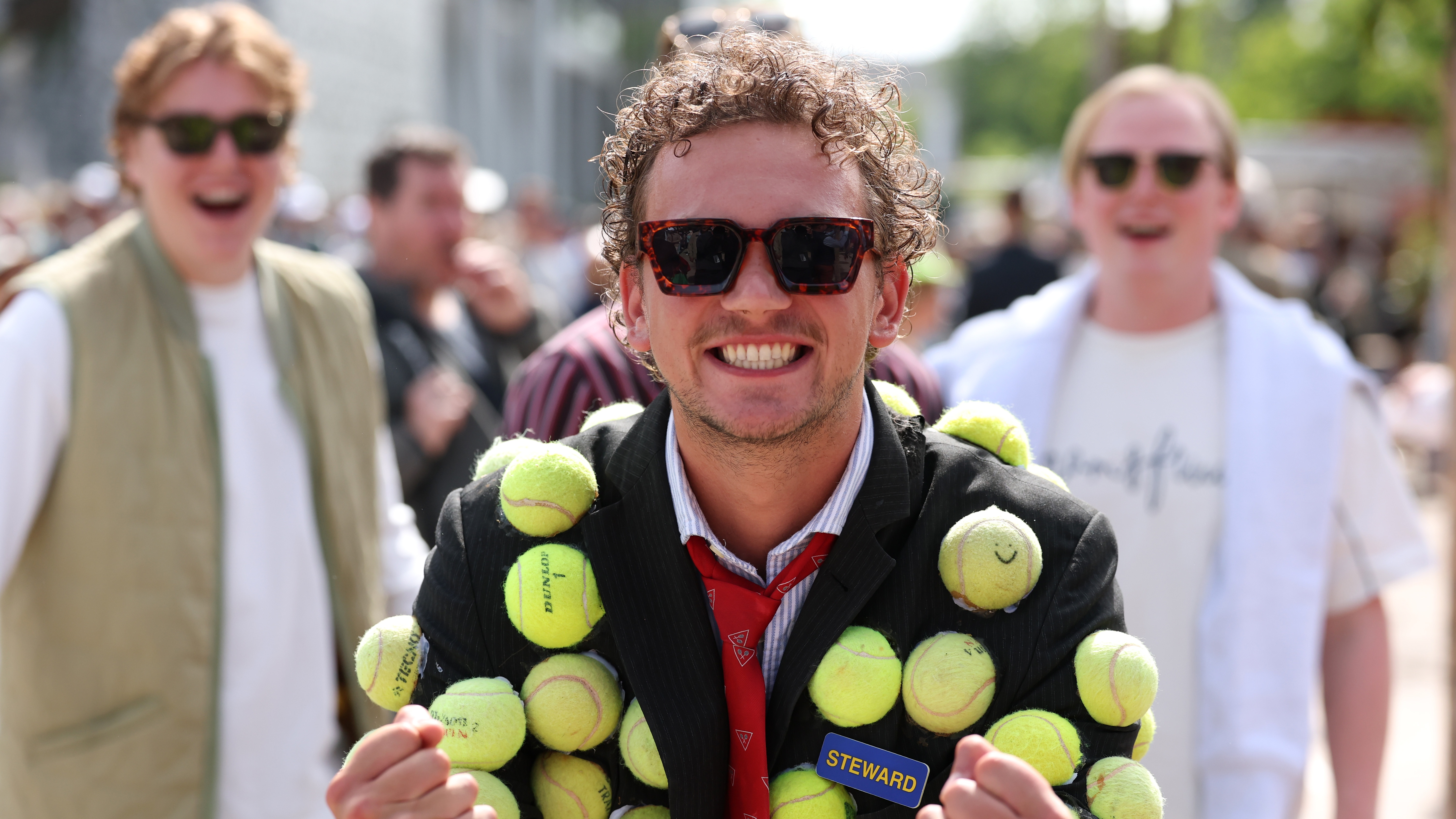 Tennis fan draped in bright yellow tennis balls poses for a photo on Day 3 of the 2025 French Open at Roland Garros 2025 on May 26, 2025 in Paris, France.
