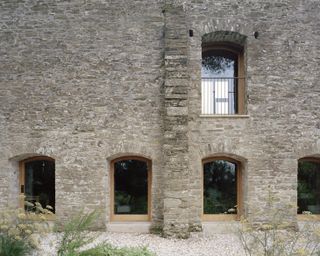 Exterior stonework of walls at modern conversion Redhill Barn in the UK