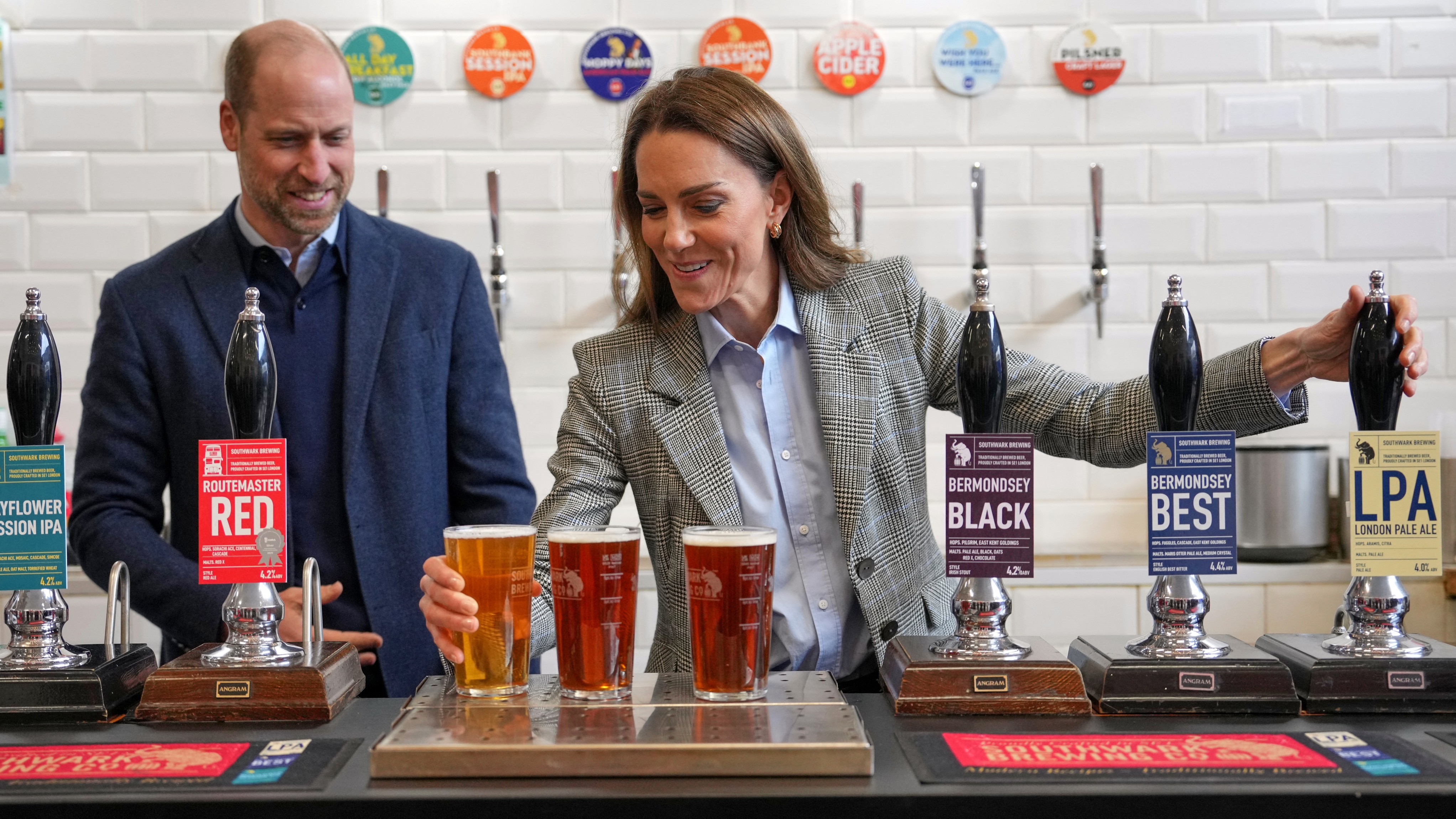 Catherine, Princess of Wales, pulls a pint alongside Prince William, Prince of Wales during a visit to the Southwark Brewing Company at the Bermondsey Beer Mile in London on March 12, 2026