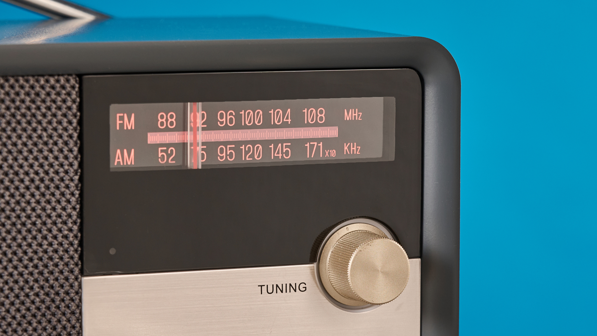 Crosley Tribute Radio in gray color photographed on a blue background