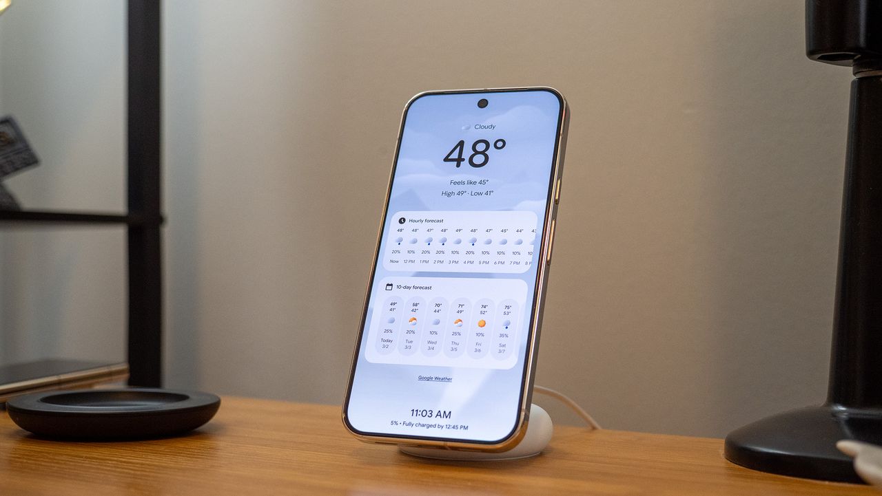 A Google Pixel 10 Pro XL on a Pixelsnap wireless charger with the screensaver function activated
